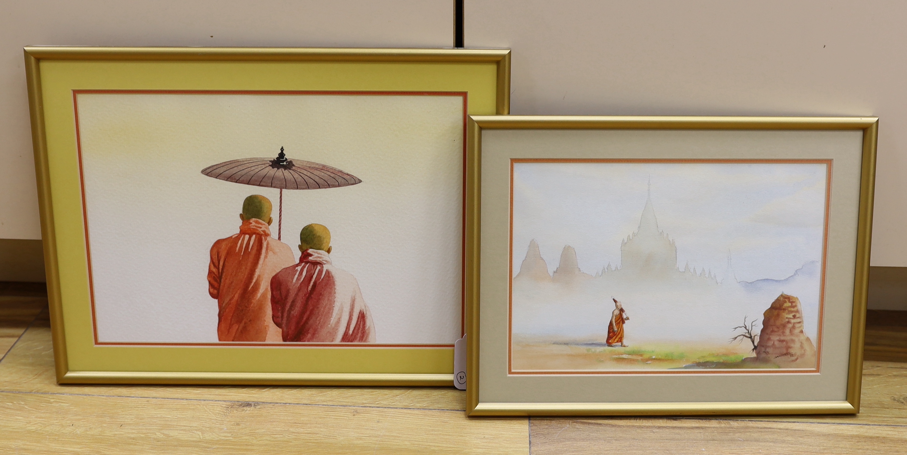 Attributed to Min Wae Aung, (Burmese, b.1960), watercolour, Two Buddhist monks and a sun shade, half length, unsigned and another similar work, largest 30 x 20cm, both in glazed frames